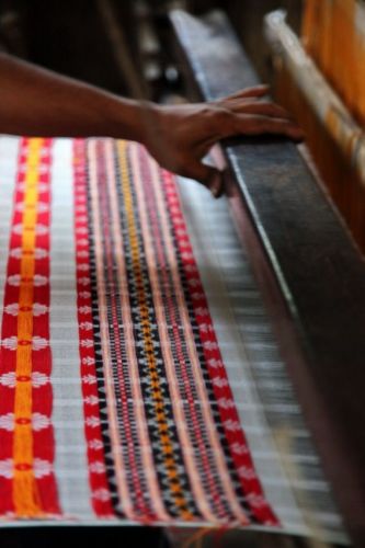 Weaving traditional Assamese scarf on jaquard loom